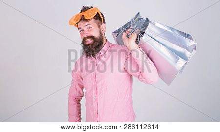 Man Bearded Hipster Wear Sunglasses Hold Bunch Shopping Bags. How To Get Ready For Your Next Vacatio