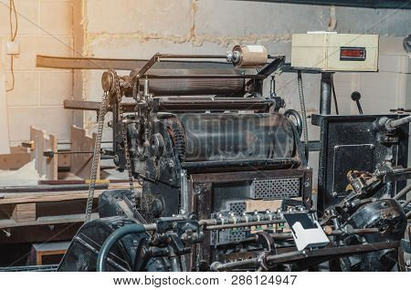 Vintage Printing Machine For Carving In Printing. Part Of Old Mechanism, Regulators, Gears.