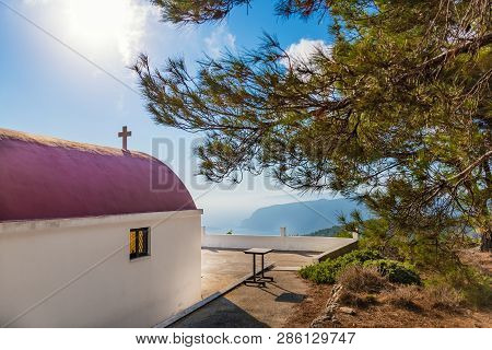 View Of Greek Orthodox Church With Cyclamen Roof Next To Forest (rhodes, Greece)