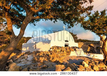 Colourful View Of Greek Orthodox Church Built On Ruins Of Monolithos Castle During Sunset (rhodes, G