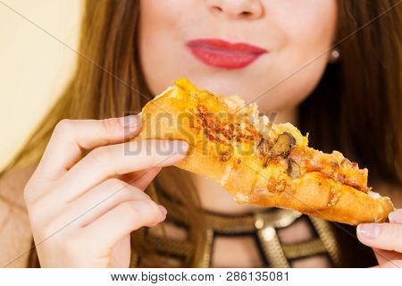 Young Woman Eating Hot Fresh Pizza Slice. Delicious Fast Food Meal. People, Italian Cuisine Concept.