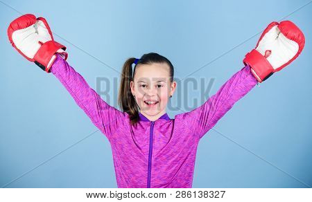 Female Boxer. Sport Upbringing. Boxing Provide Strict Discipline. Girl Cute Boxer On Blue Background