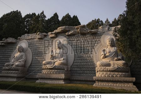 Statues Of The 3 Buddhas On The Thousand Buddha Mountain Autumn Evening, Jinan, China