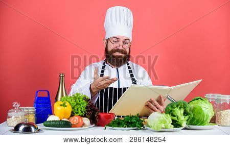Culinary Arts Concept. Amateur Cook Read Book Recipes. Man Learn Recipe. Try Something New. Cookery 