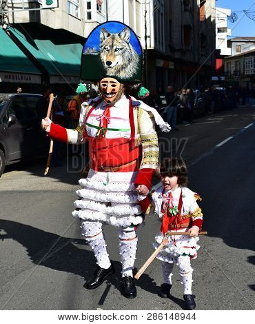 Verin, Spain, 24 Feb 2019. Famous Carnival And Street Parade With Cigarrons Costumes. Ourense Provin
