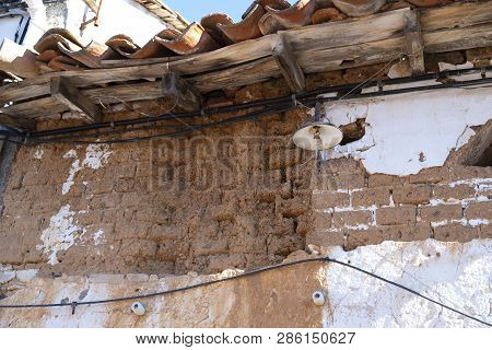 Ruins Of An Old Village House Made Of Adobe Nd Wood