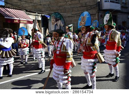 Verin, Spain, 24 Feb 2019. Famous Carnival And Street Parade With Cigarrons Costumes. Ourense Provin