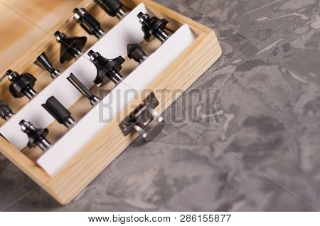Set Of Steel Router Bit For Milling Cutter In Rectangle Wooden Box With Metal Lock On Old Broken Wor