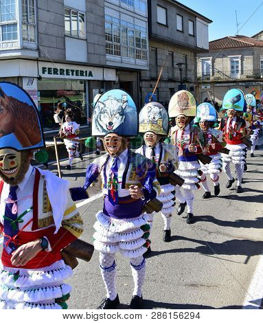 Verin, Spain, 24 Feb 2019. Famous Carnival And Street Parade With Cigarrons Costumes. Ourense Provin