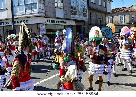 Verin, Spain, 24 Feb 2019. Famous Carnival And Street Parade With Cigarrons Costumes. Ourense Provin