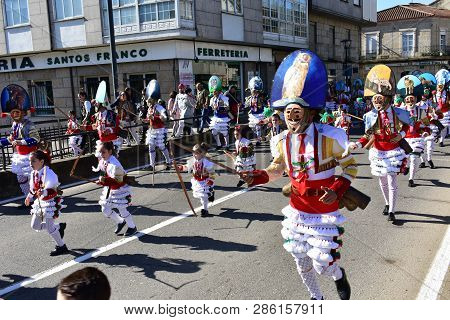 Verin, Spain, 24 Feb 2019. Famous Carnival And Street Parade With Cigarrons Costumes. Ourense Provin