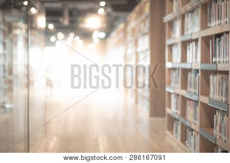 Abstract Blurred Public Library Interior Space. Blurry Room With Bookshelves By Defocused Effect. Us