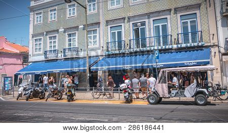 Lisbon, Portugal - May 7, 2018: People Queuing In Front Of The Famous Bakery Pasteis Belem To Buy Th