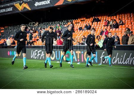 VALENCIA, SPAIN - FEBRUARY 21: Referee team during UEFA Europa League match between Valencia CF and Celtic FC at Mestalla Stadium on February 21, 2019 in Valencia, Spain