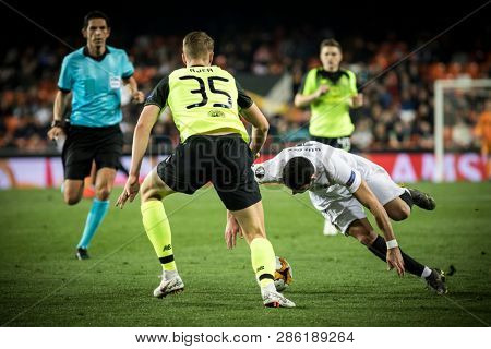 VALENCIA, SPAIN - FEBRUARY 21: Fault to Guedes (R) during UEFA Europa League match between Valencia CF and Celtic FC at Mestalla Stadium on February 21, 2019 in Valencia, Spain