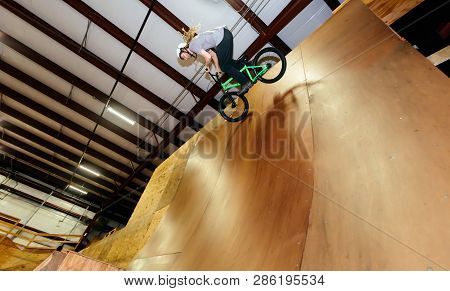 Man Jumping And Riding On A Bmx Bicycle At An Extreme Sports Park