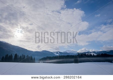 View From Bad Mitterndorf To Snow Covered Mountain Kammspitz On A Cloudy Day In Winter In Styria, Au
