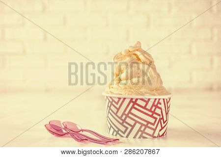 Retor Toning. Soft Ice Cream In Paper Cup On White Background