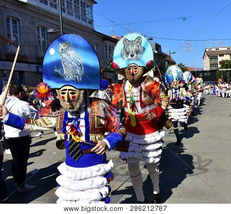 Verin, Spain, 24 Feb 2019. Famous Carnival And Street Parade With Cigarrons Costumes. Ourense Provin