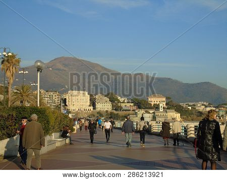 Genova, Italy - 02/14/2019: An Amazing Caption Of The Sunset Over The Sea And The City Of Genoa In W