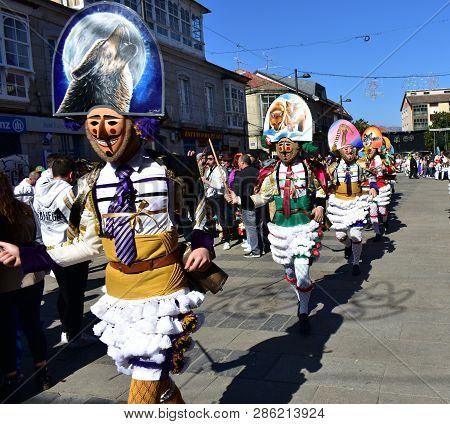 Verin, Spain, 24 Feb 2019. Famous Carnival And Street Parade With Cigarrons Costumes. Ourense Provin