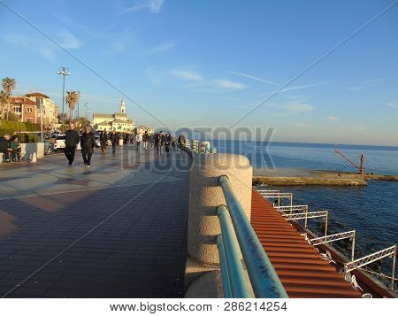 Genova, Italy - 02/14/2019: An Amazing Caption Of The Sunset Over The Sea And The City Of Genoa In W