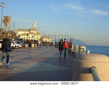 Genova, Italy - 02/14/2019: An Amazing Caption Of The Sunset Over The Sea And The City Of Genoa In W