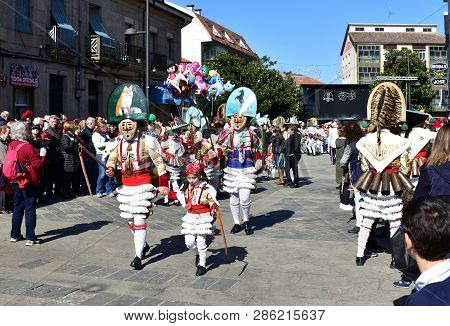 Verin, Spain, 24 Feb 2019. Famous Carnival And Street Parade With Cigarrons Costumes. Ourense Provin
