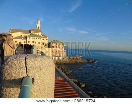 Genova, Italy - 02/14/2019: An Amazing Caption Of The Sunset Over The Sea And The City Of Genoa In W