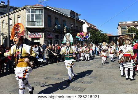 Verin, Spain, 24 Feb 2019. Famous Carnival And Street Parade With Cigarrons Costumes. Ourense Provin