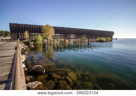 Marquette Michigan Downtown Waterfront District. Iron Ore Docks And Lake Superior Shore Of The Downt