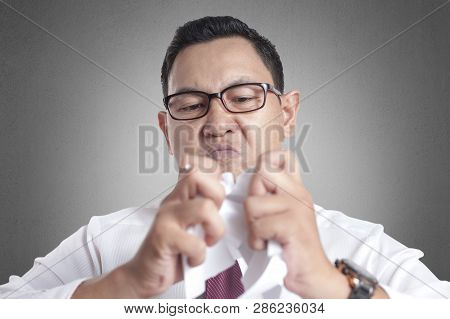 Angry Businessman Rip Off Contract Paper