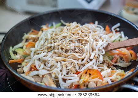 Japanese Ramen Soup With Chicken, Egg, Chives And Sprout On Dark Wooden Background.