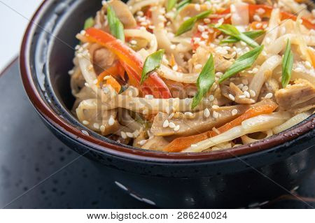 Japanese Ramen Soup With Chicken, Egg, Chives And Sprout On Dark Wooden Background.