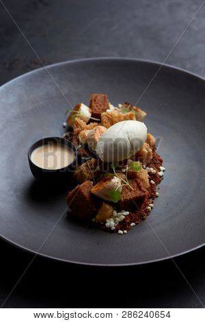 dessert with cake, fried banana, vanilla ice cream, toffee and vanilla sauce
