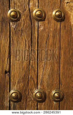 Bronze Studs Attached To Wooden Planks At Caceres