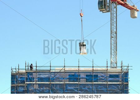 Gosford, New South Wales, Australia - November 30, 2018:  Crane Operator Managing Equipment Delivey 