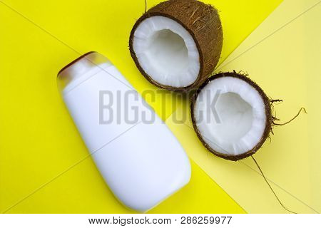 Flat Lay Coconut And Mock Upwhite  Plastic  Bottle  On A Yellow Background