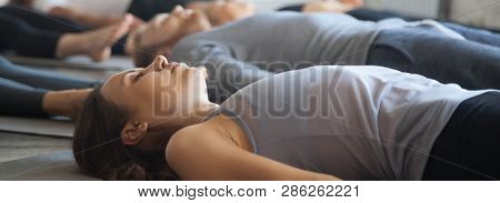 Horizontal Image Group Yoga Session People Practice Savasana Corpse Pose