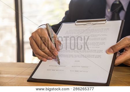 Business Man Deal A Contract And On Business Office. Owns The Business Sign Personally, Director Of 