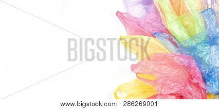 Multicolored Single Use Plastic Shopping Bags On White Banner Background