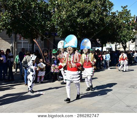 Verin, Spain, 24 Feb 2019. Famous Carnival And Street Parade With Cigarrons Costumes. Ourense Provin