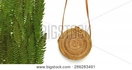 Fashionable Handmade Natural Organic Rattan Bag And Green Fern Leaves, Pink Flower Isolated On White