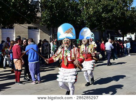 Verin, Spain, 24 Feb 2019. Famous Carnival And Street Parade With Cigarrons Costumes. Ourense Provin