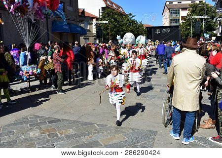 Verin, Spain, 24 Feb 2019. Famous Carnival And Street Parade With Cigarrons Costumes. Ourense Provin
