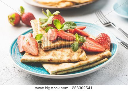Crepes With Strawberry On Blue Plate. Blini With Fresh Red Berries. Sweet Breakfast Food Or Dessert