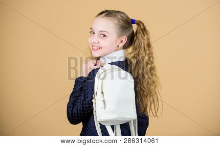 Carrying Things In Backpack. Schoolgirl Ponytails Hairstyle With Small Backpack. Learn How Fit Backp