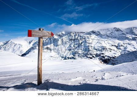 View Of A Sign Near The Punta San Matteo Peak In The Alps