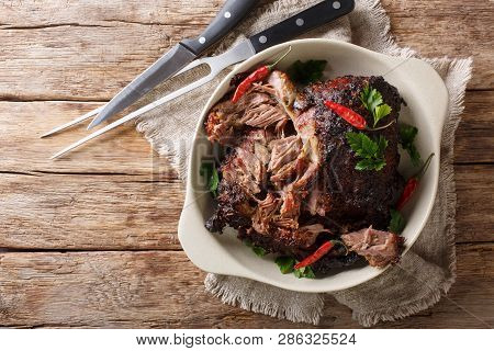 Pernil Asado Slow Cooked Shredded Pulled Pork Close-up On A Plate. Horizontal Top View