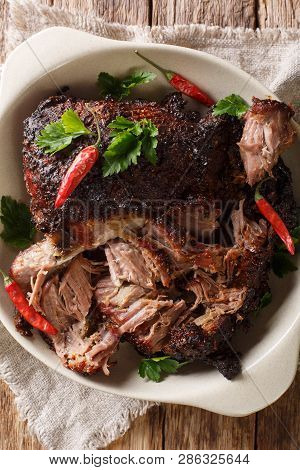 National Latin American Dish Of Pernil Asado Shredded Pork Closeup On A Plate. Vertical Top View